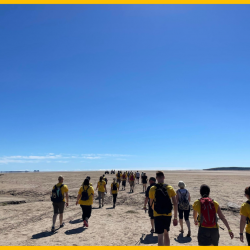 A photo of people walking on Morecambe Bay to raise money for North West Air Ambulance